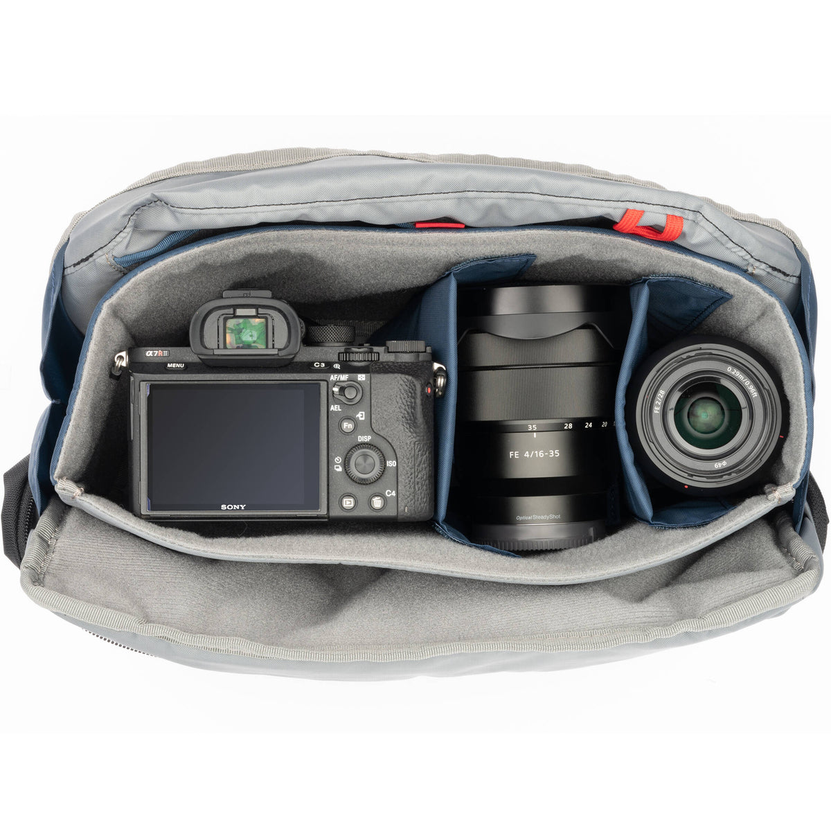 Think Tank PressPass video equipment bag with padded compartments and adjustable straps for professional camera gear storage.