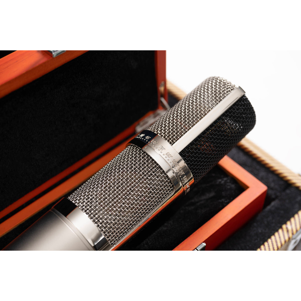 Warm Audio WA-CX24 condenser microphone shown with its sleek design and metal grille, ideal for studio recording and vocals.