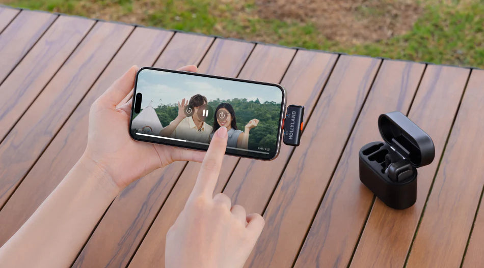 Hollyland Lark M2S wireless microphone system with camera and USB-C receiver, featuring a Lightning cable for iOS devices.