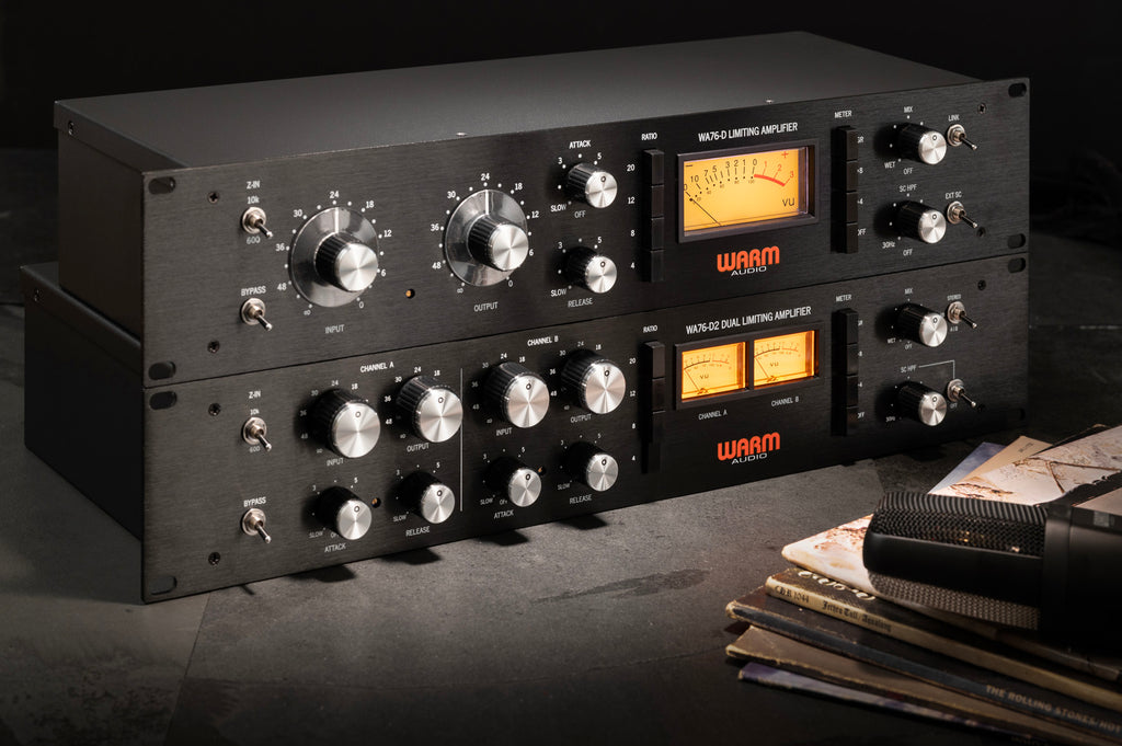 Warm Audio WA76-D signal processor with vintage-style knobs and meters, mounted in a professional audio setup.