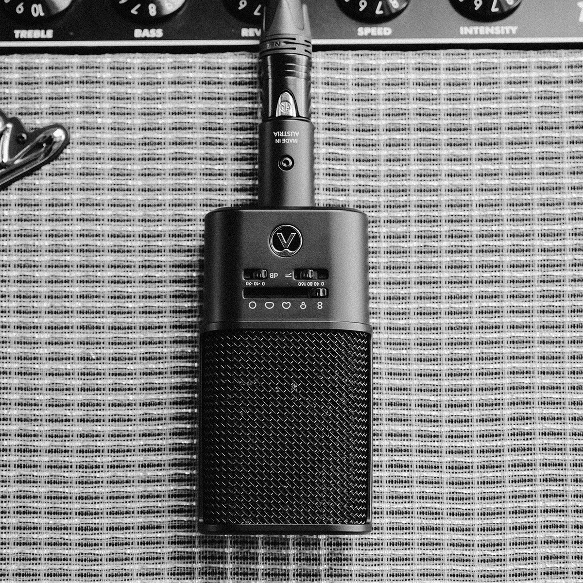 Austrian Audio OC616 in front of a guitar amplifier