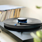 Ortofon Concorde Music Blue turntable cartridge mounted on a Pro-Ject turntable, close-up view of the cartridge and tonearm.