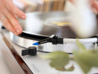 Ortofon Concorde Music Blue turntable cartridge mounted on Thorens turntable, showcasing sleek blue stylus and cartridge body.