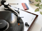 Ortofon Concorde Music Bronze turntable cartridge installed on Thorens turntable, showcasing its sleek design and gold-colored stylus.