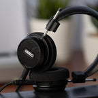 Grado Signature S150 headphones on a desk, close-up of the open-back grille