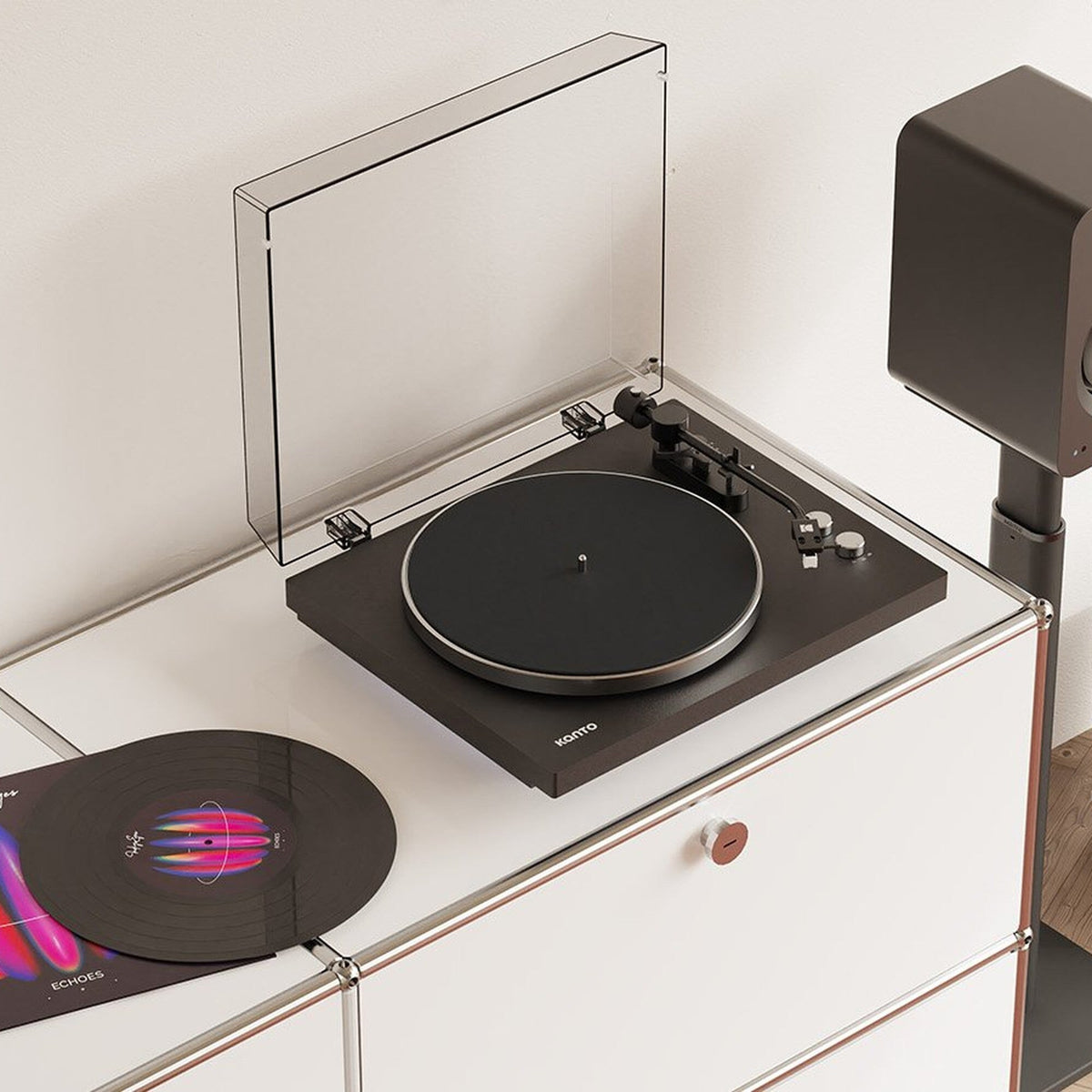 Kanto Audio OBI3 Gen 2 black belt-drive turntable on a white shelf with a vinyl record