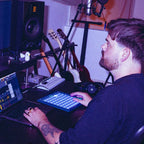 Novation FLpad, on a producer desk beside studio monitors