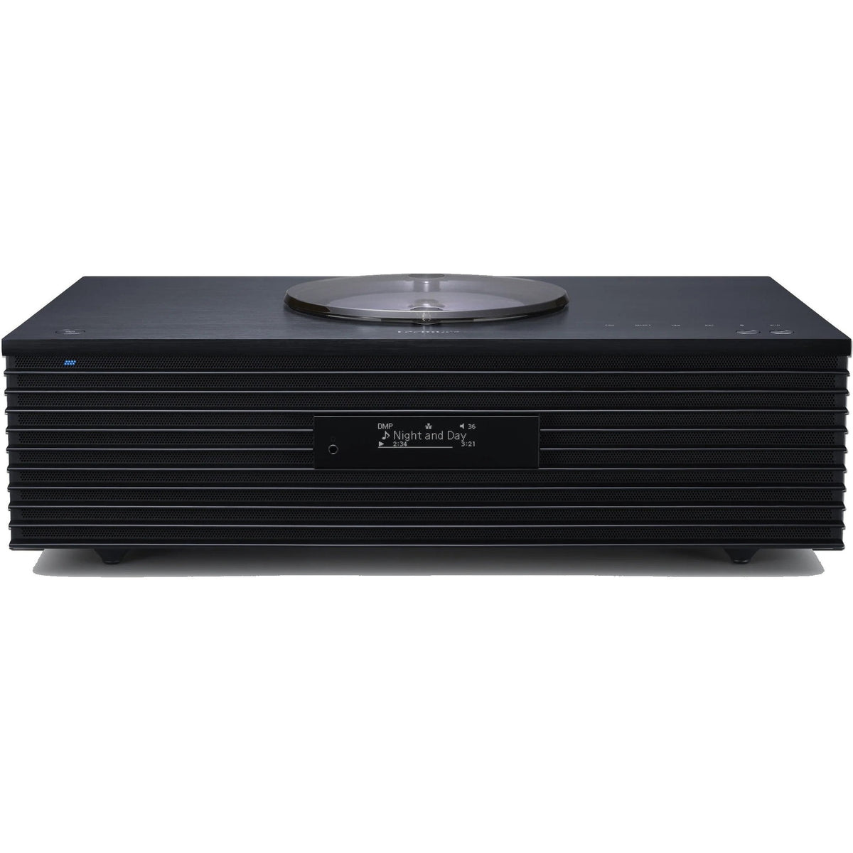 Technics SC-C70MK2 CD player with sleek design, digital display, and control buttons on top, in a modern home audio setup.